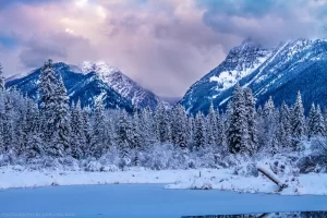 The edge of the Cabinet Mountains range over a frozen Bull River.
