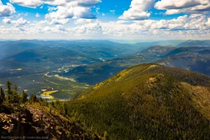 The town of Troy in the Kootenai River Valley, with the lower ridge of Grambauer Mountain in the foreground. Kootenai National Forest / Cabinet Mountain Wilderness, Montana.