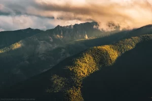 The sun sets on Grambauer during a misty autumn evening.