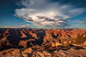 A Storm over the Grand Canyon with a rainbow peaking out of the clouds. Grand Canyon National Park, Arizona.