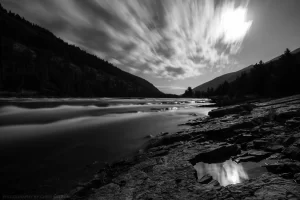 The Kootenai River lit by moonlight.