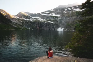 Sitting on the edge of Leigh Lake on a smoky summer evening.